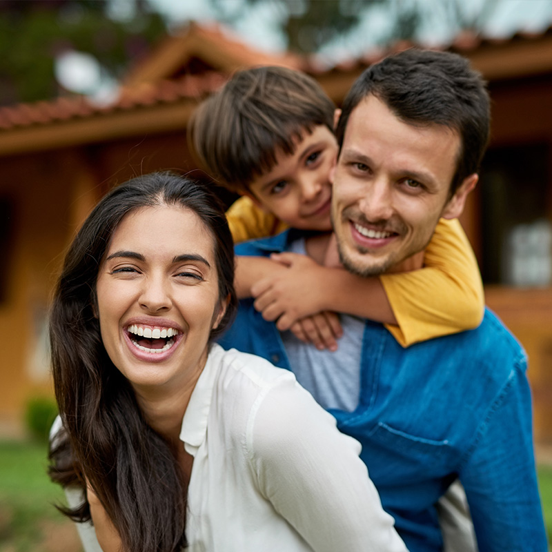 Portrait of a beautiful young family spending some time together outdoors