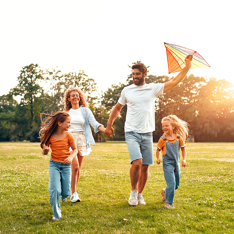 Happy family relaxing in the park