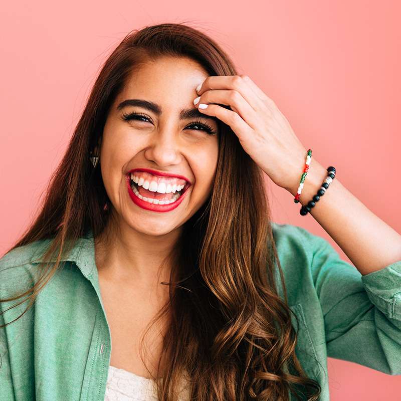 Portrait of Mexican Woman on pink background